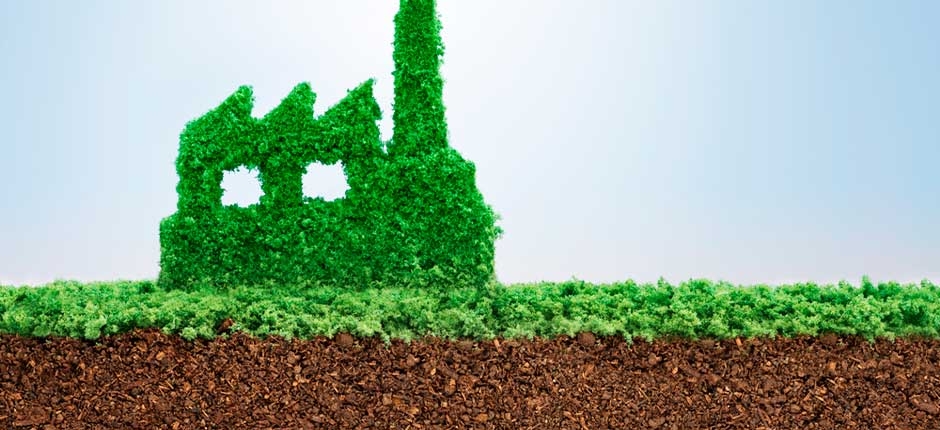 ilustração da importância da sustentabilidade econômica, onde na imagem exibe uma representação estilizada de uma fábrica feita de folhagem verde
