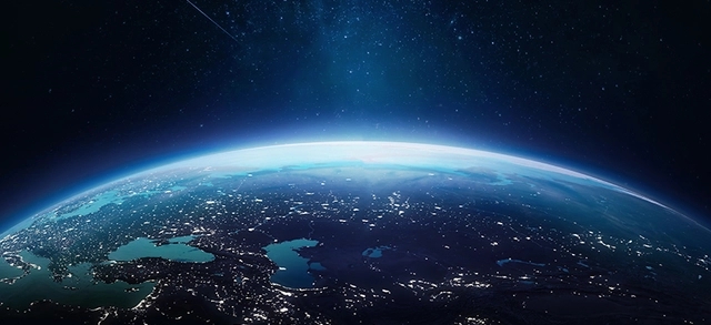 foto do planeta terra tirada do espaço e nela enxergamos pequenos pontos de luzes e claridade